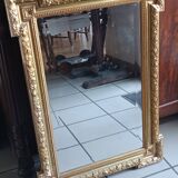 Antique mirror in wood and gilded stucco, neo Louis XVI style.