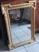 Antique mirror in wood and gilded stucco, neo Louis XVI style.