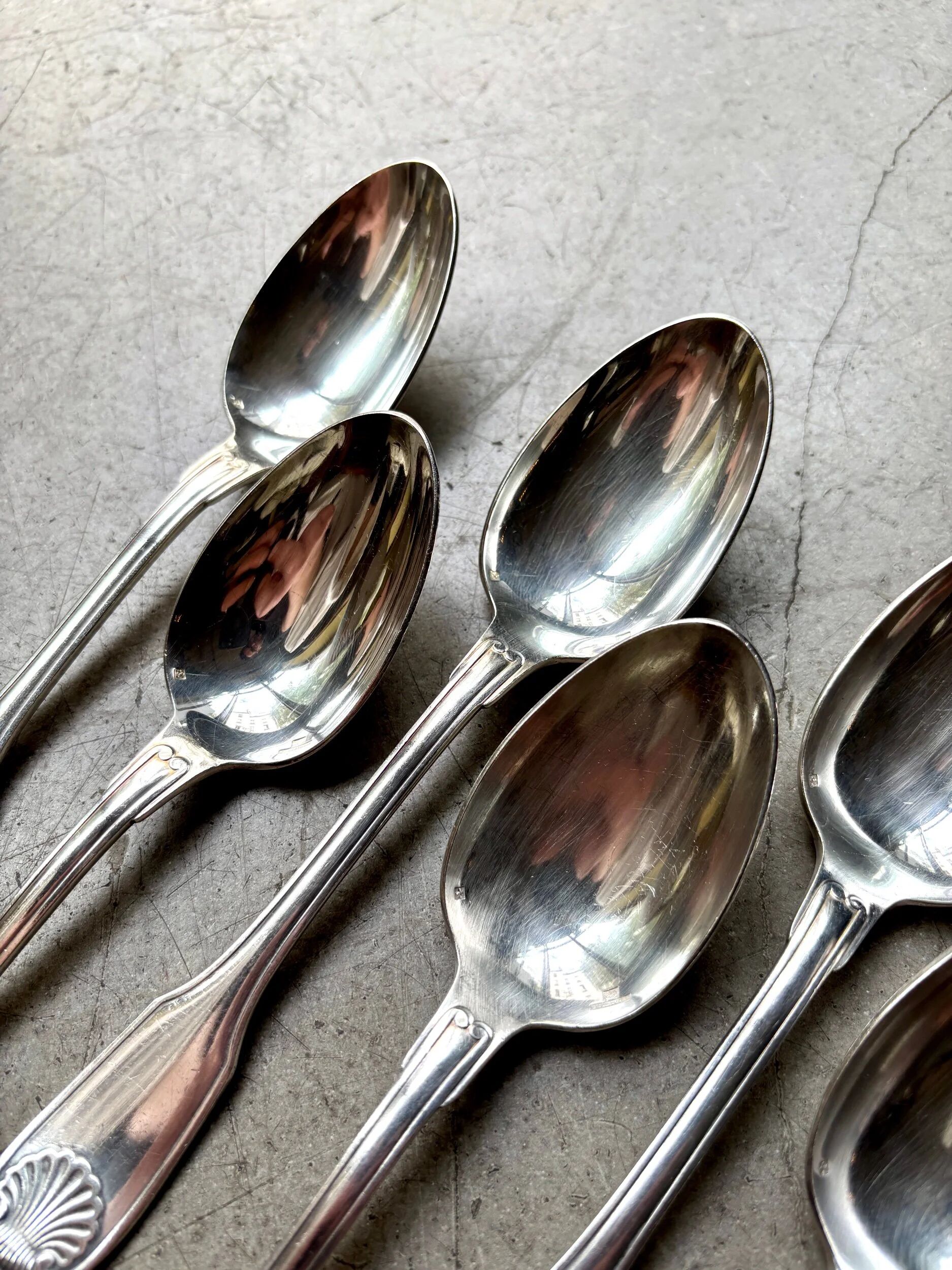 6 large Christofle silver-plated spoons with shell decoration.