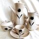 Vintage 23-piece Niderviller coffee set with hand-painted black tulip decor.