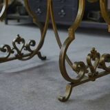 Side table with a gilt wrought iron base attributed to Gilbert Poillerat, with a travertine top, 1940s