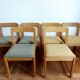 Six Scandinavian style chairs in elm and fabric.