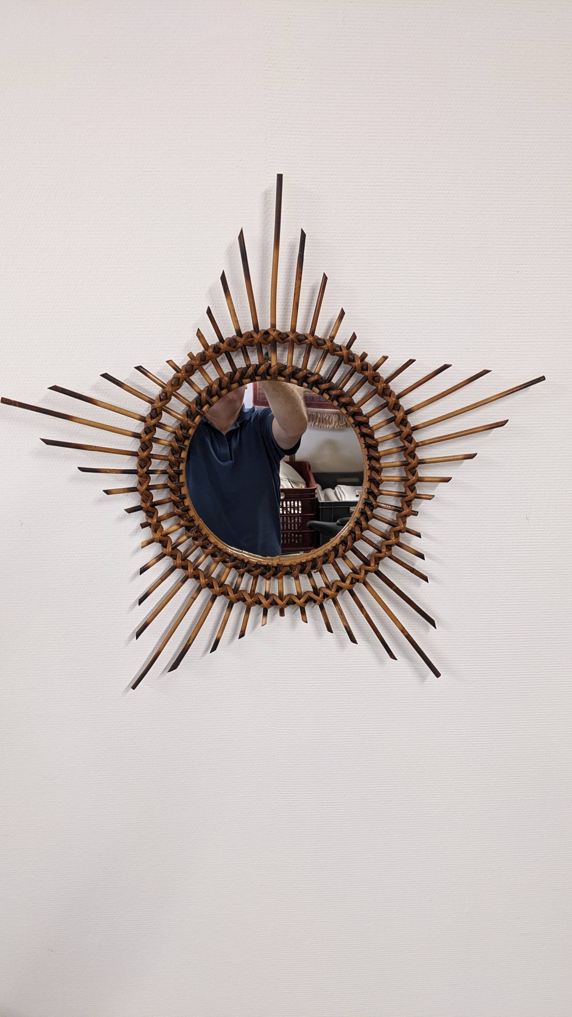 Starry sun mirror in rattan, France around 1960.