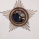 Starry sun mirror in rattan, France around 1960.
