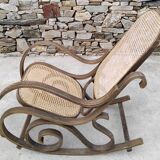 Vintage wooden and cane rocking chair