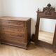 Antique wooden commode with marble top and mirror.