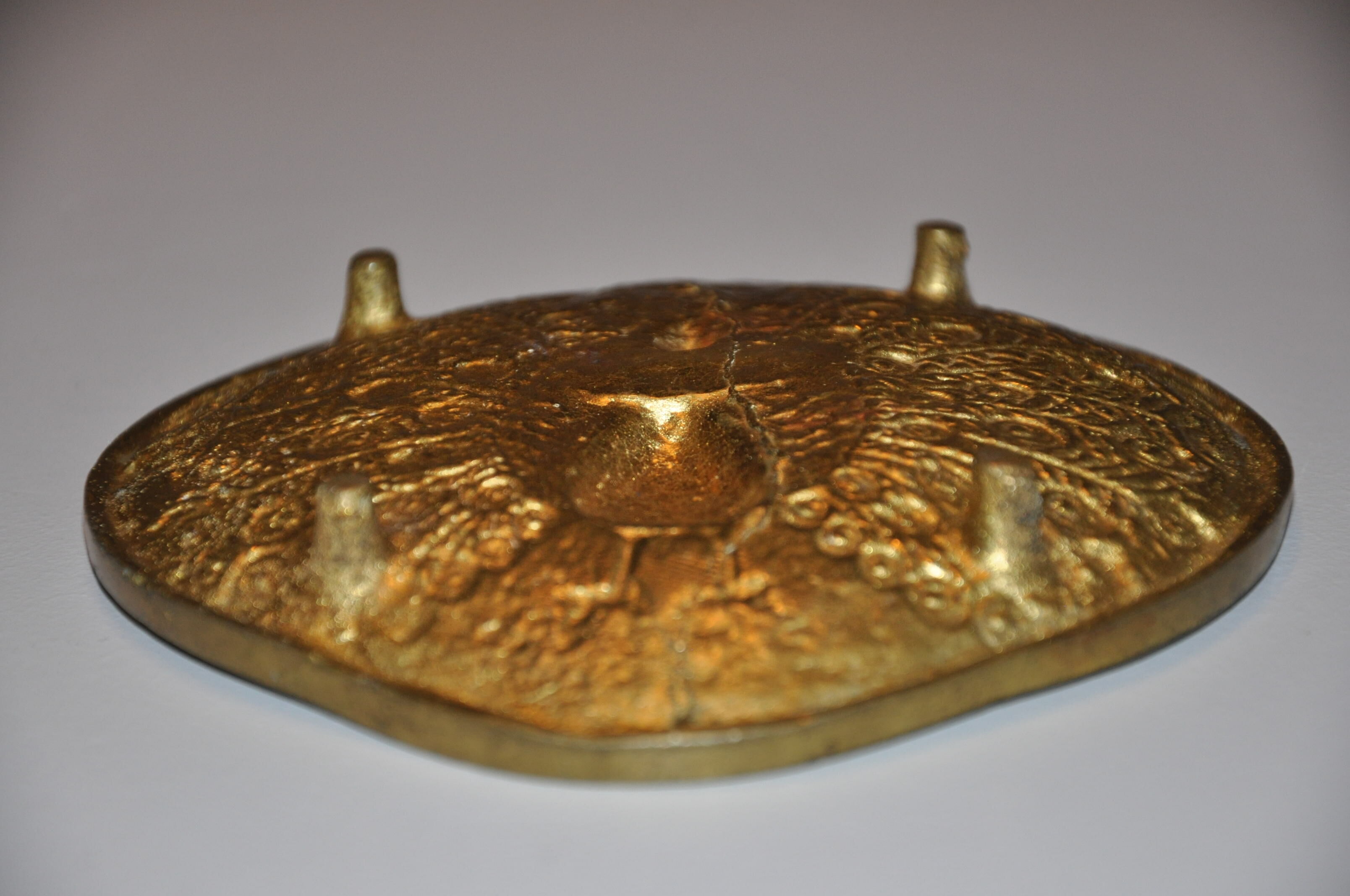 Brass pocket with peacock decoration