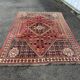 Large red Persian wool rug with red geometric design 2.97 x 2.05 m