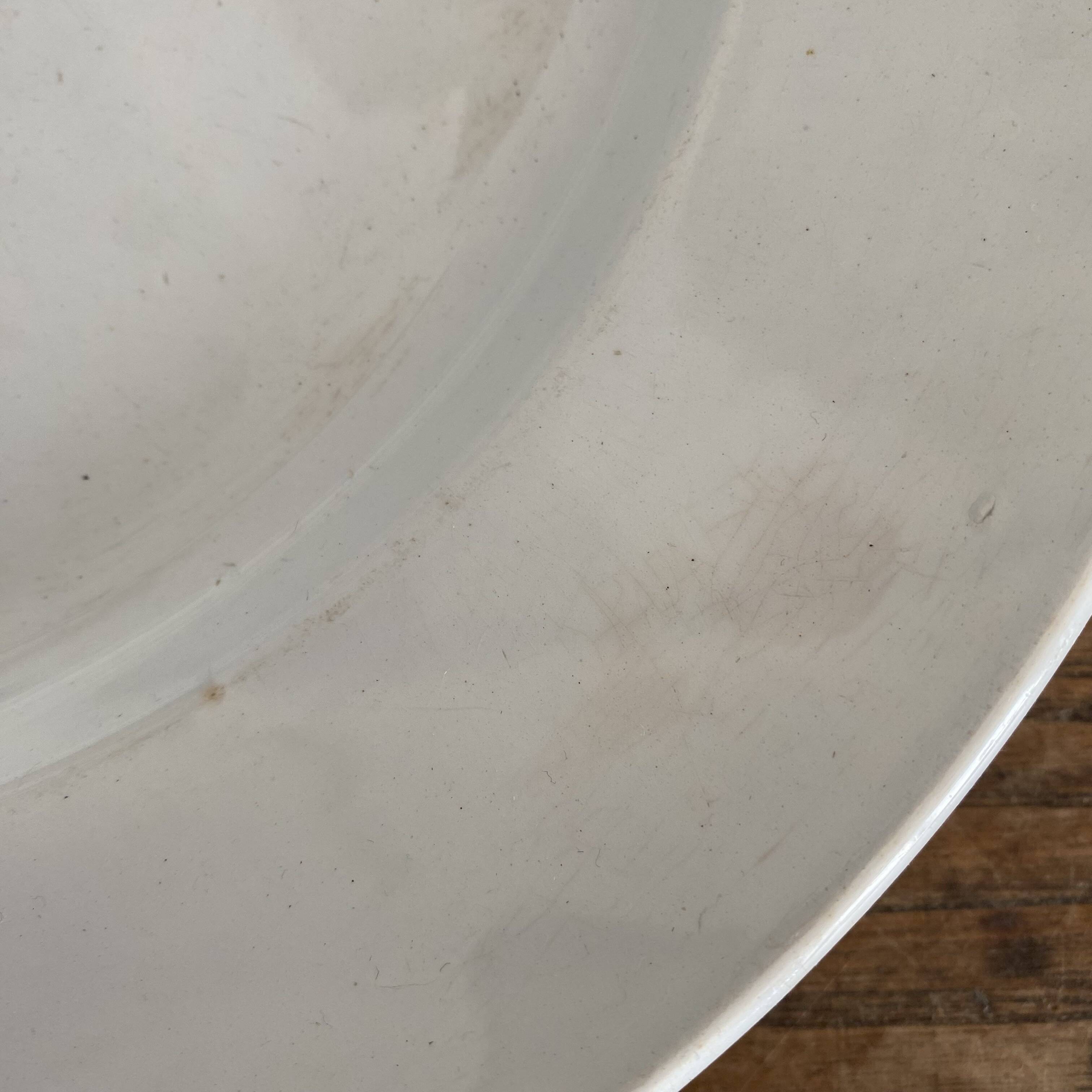 Set of large round white earthenware dishes from Creil and Montereau, 19th century
