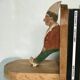 Old wooden bookends with painted characters