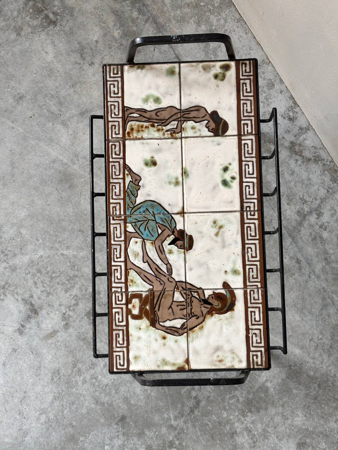 Vintage magazine table with Greek mythology motif.