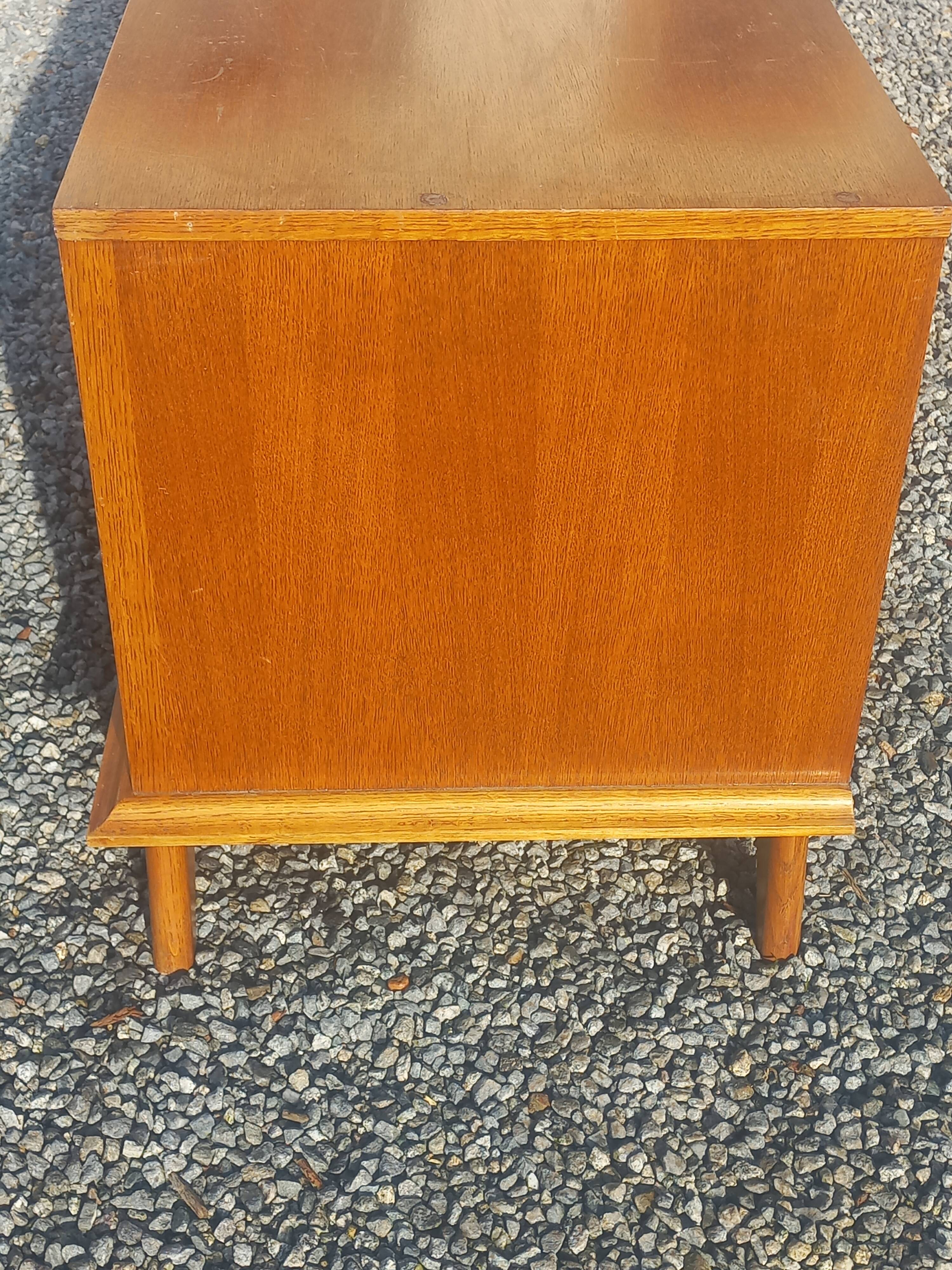 Vintage oak sideboard with splayed legs from the 1950s.