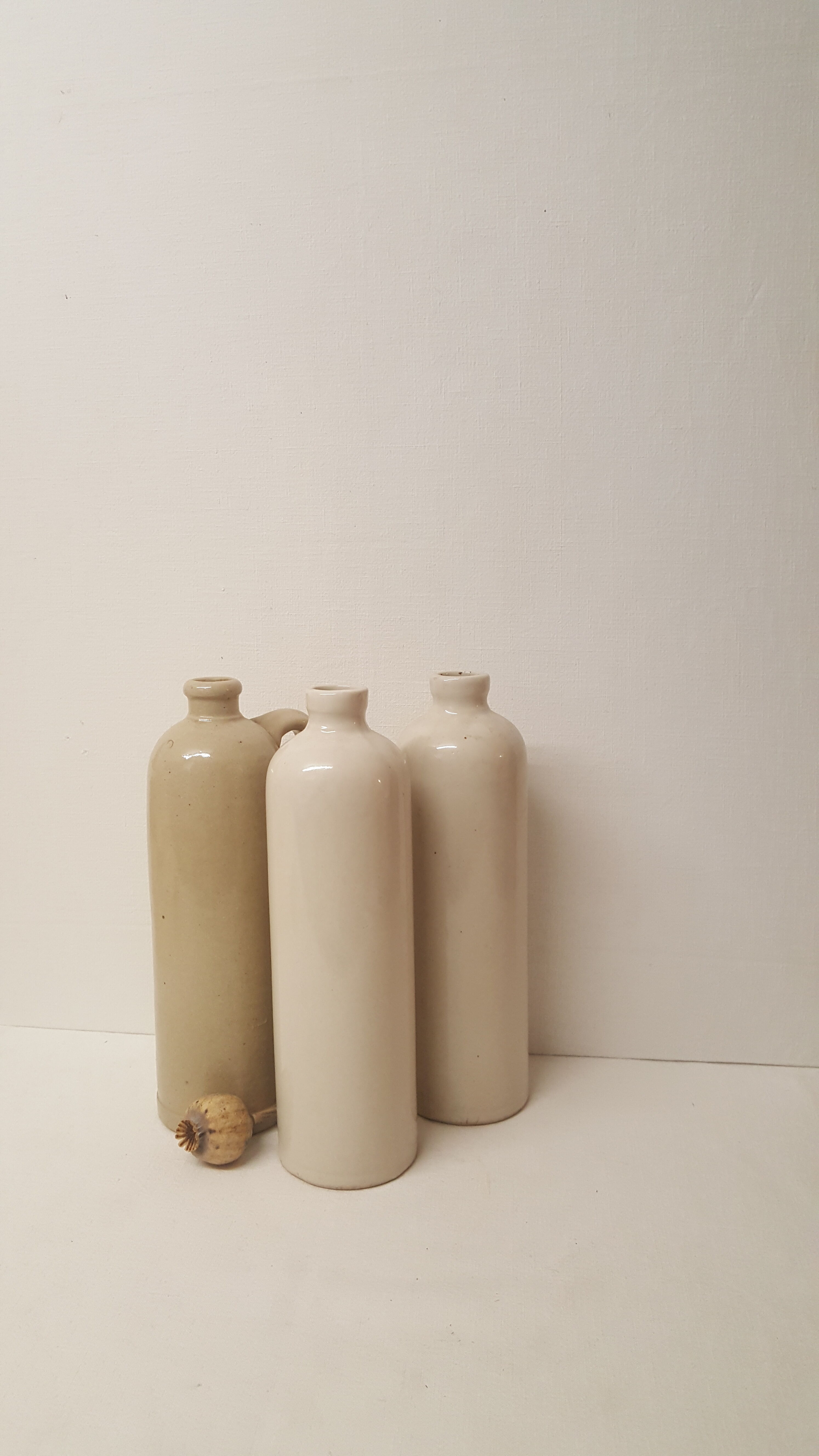 3 sandstone bottles