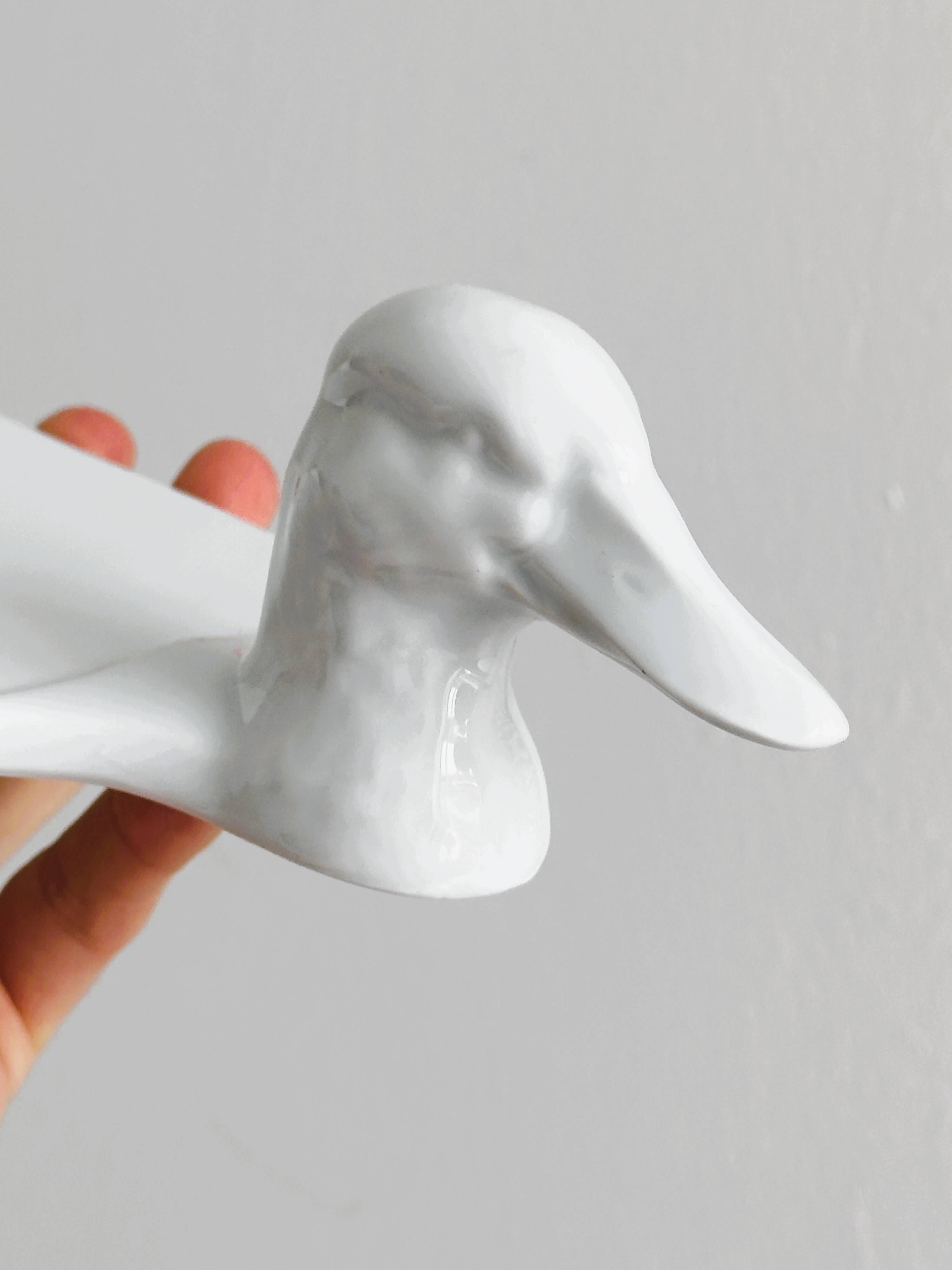 White porcelain dish in the shape of a duck.