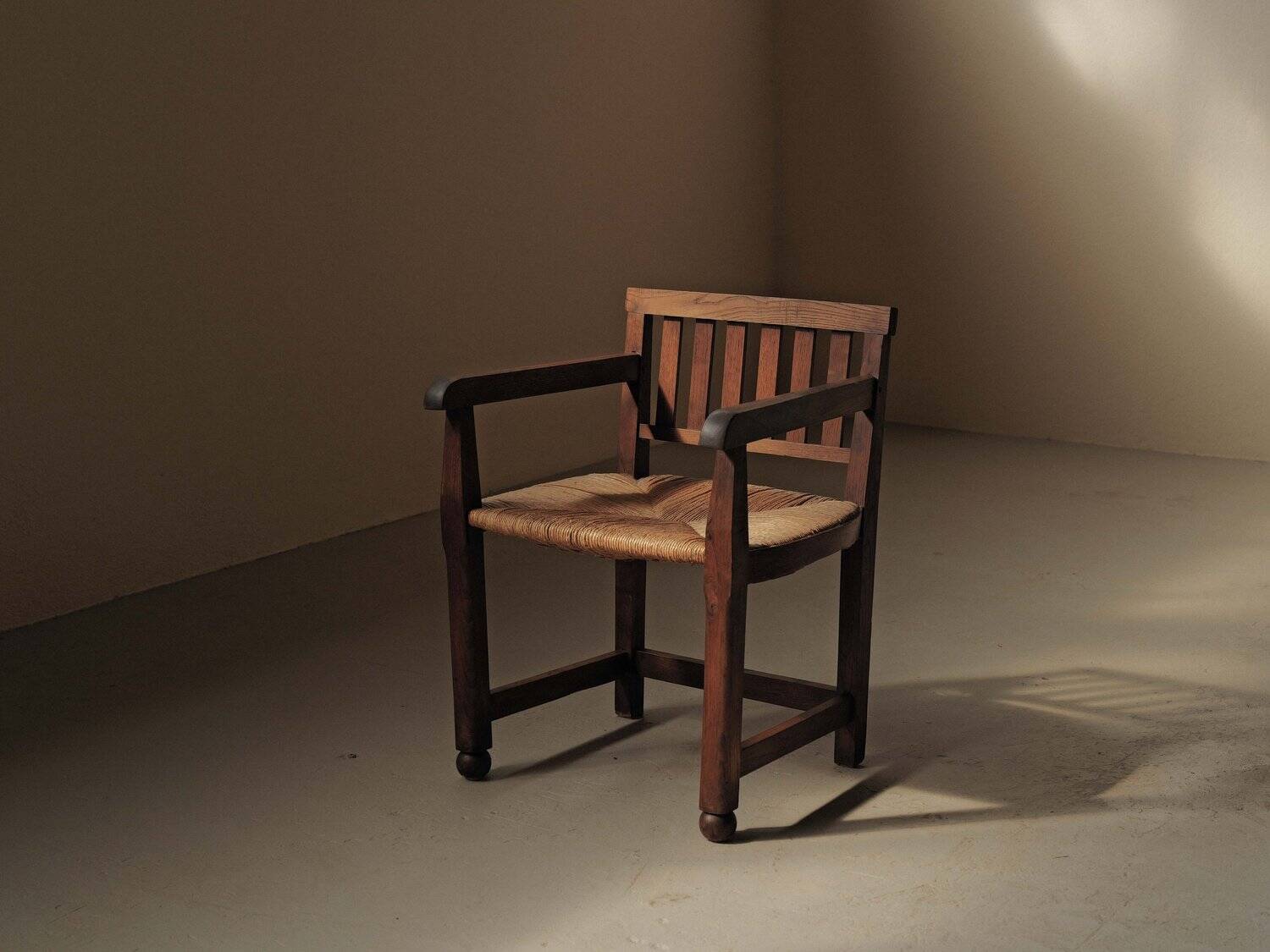 Handcrafted oak and straw armchair, France, circa 1950.