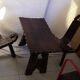Brutalist living room that consists of 2 chairs and a vintage coffee table 60s