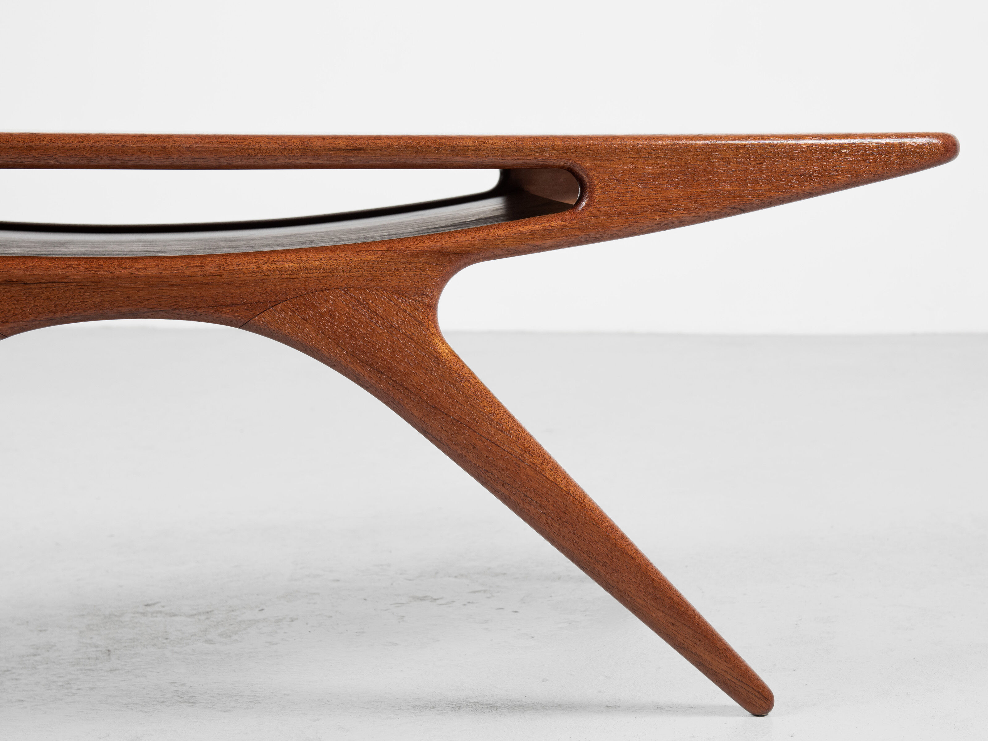 Midcentury danish smile coffee table in teak by johannes andersen for silkeborg 1950s