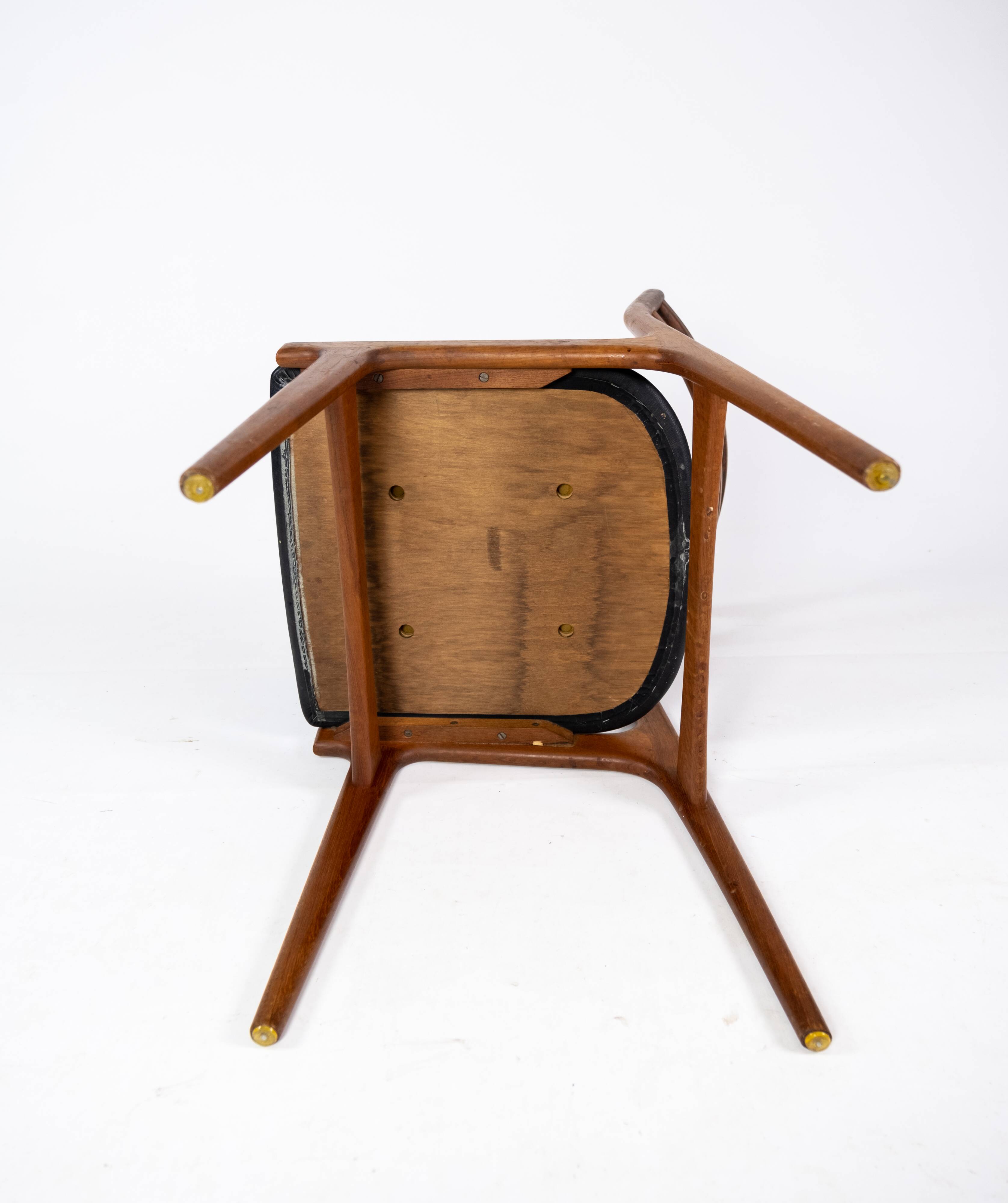 A set of four dining room chairs of teak of danish design, 1960s