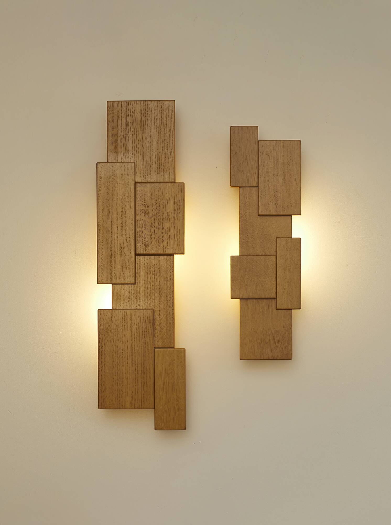 Pair of handcrafted modernist solid oak wall lights, circa 1980