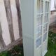 Parisian style display cabinet with 2 doors and 3 shelves in Luxembourg green.