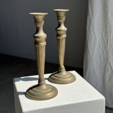Pair of classic candlesticks in patinated gold metal H25