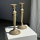 Pair of classic candlesticks in patinated gold metal H25