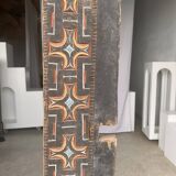 Indonesian construction element in carved wood with cross pattern in red, white geometric frieze