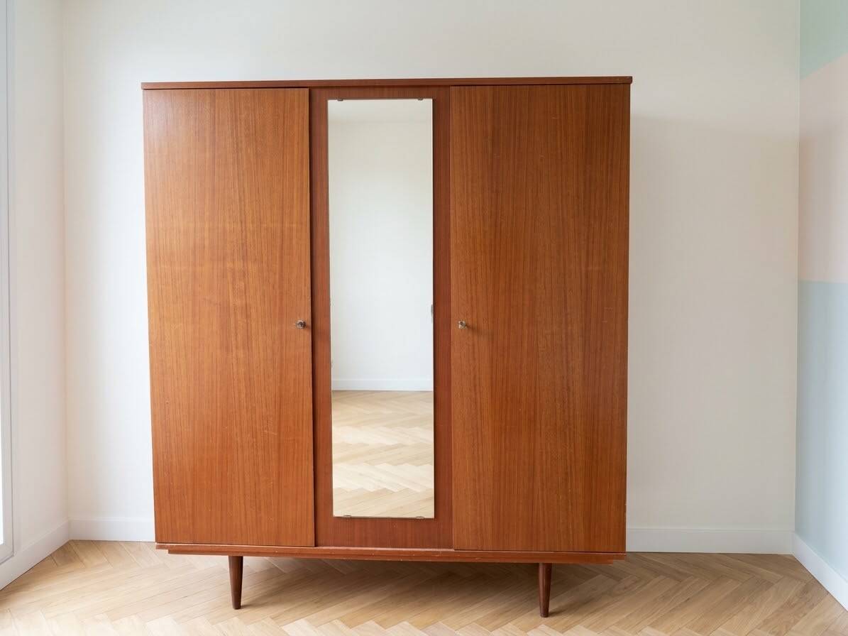 Vintage 1950s wooden wardrobe with mirror.