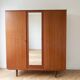 Vintage 1950s wooden wardrobe with mirror.