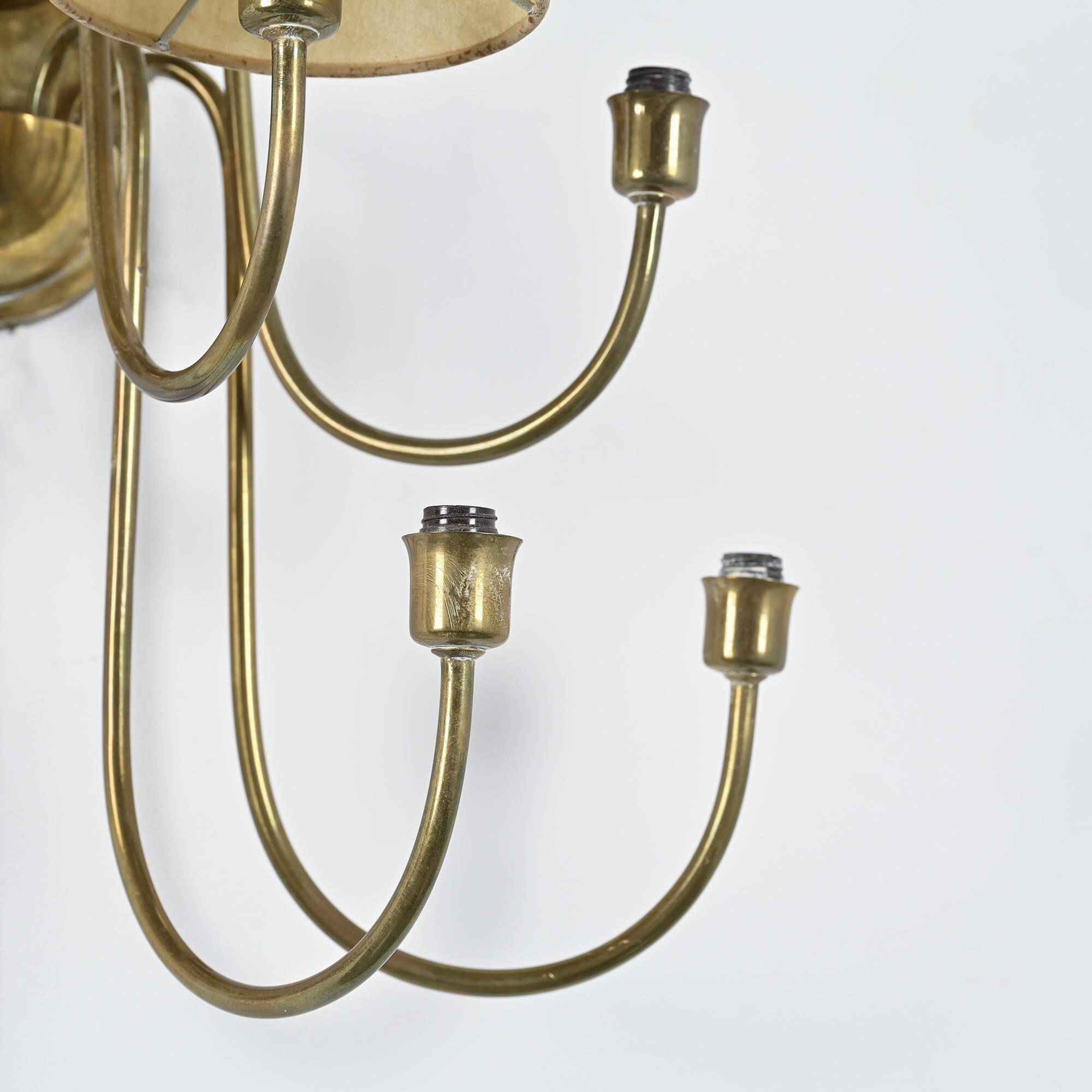 Wall sconce with nine arms in brass, France, circa 1950.