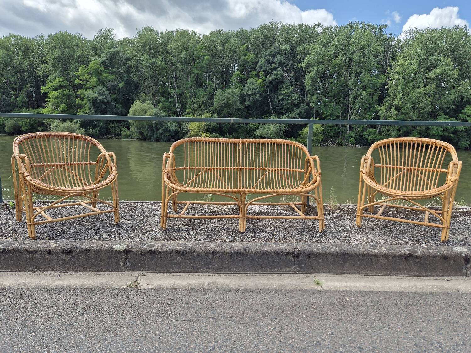 Rattan lounge with two armchairs and a vintage 1950s bench.