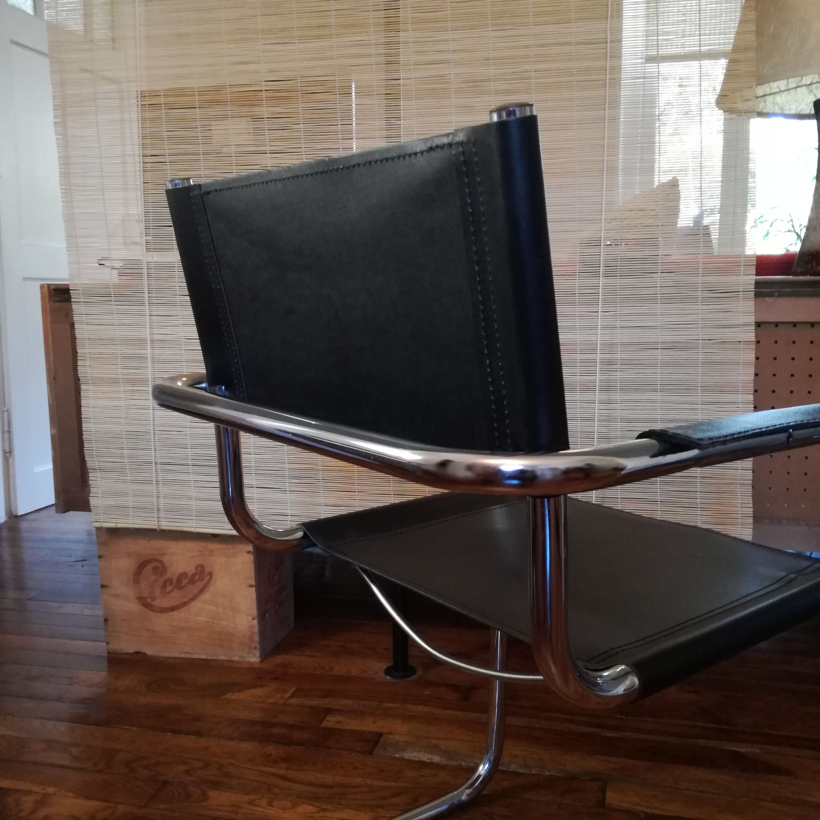 Black leather cantilever armchair