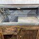 Early 20th-century oak bar counter with period zinc and tin cladding.
