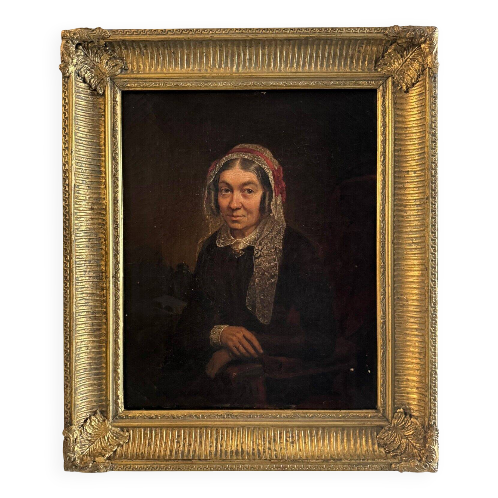 Late 19th century portrait representing a woman with a headdress and lace