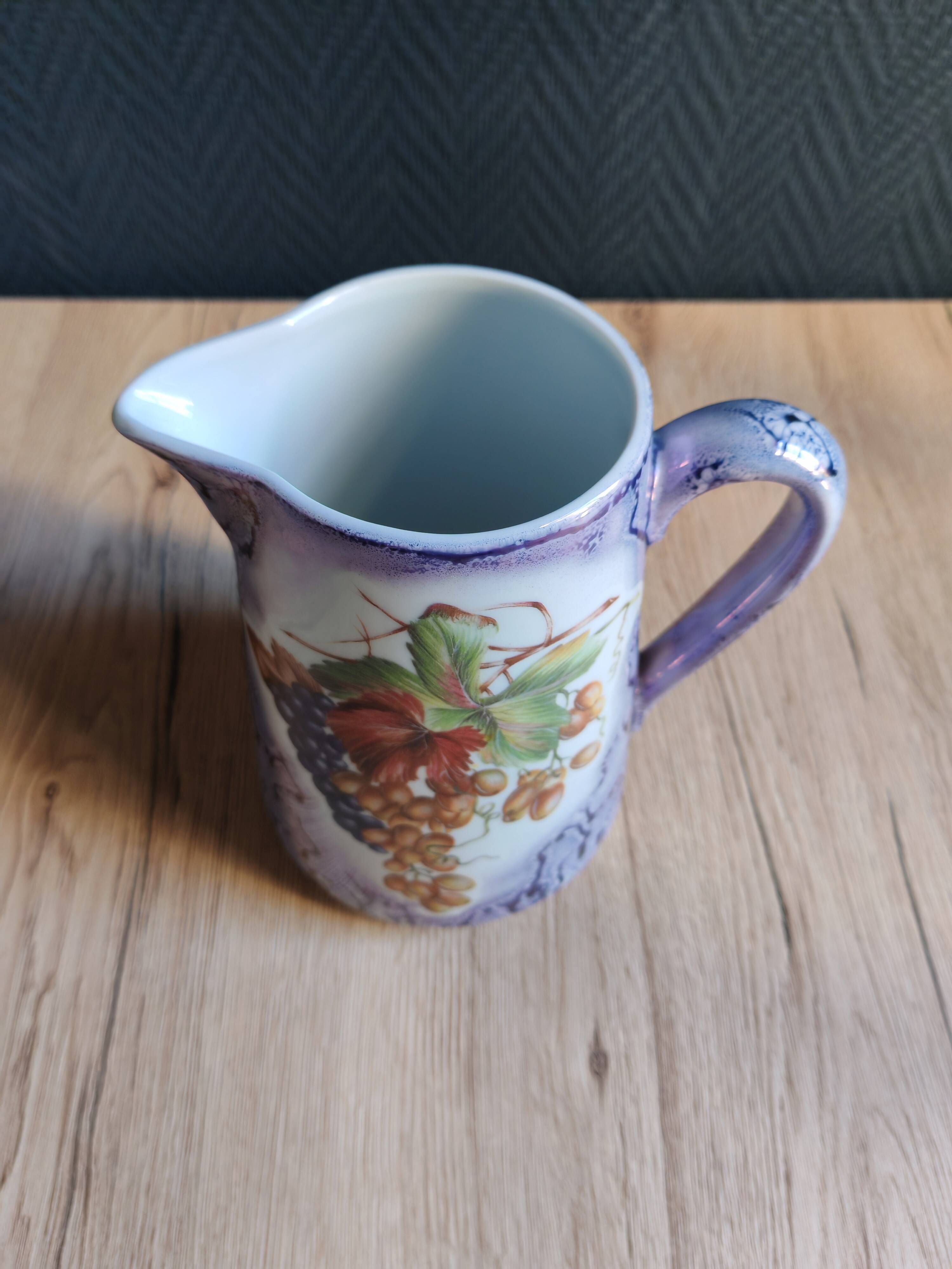 Vintage porcelain pitcher Lusseray France, decorated with grape clusters.