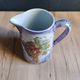 Vintage porcelain pitcher Lusseray France, decorated with grape clusters.