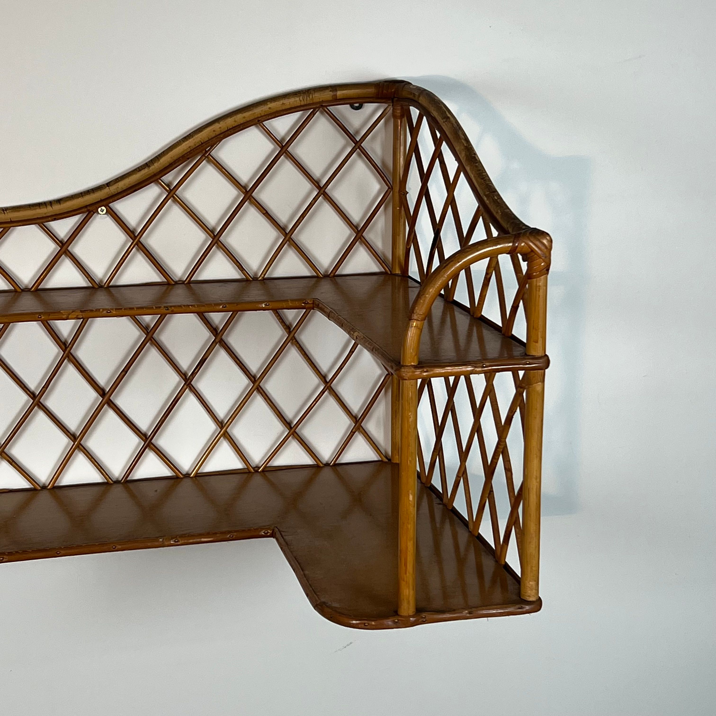 Corner wall shelf in rattan attributed to Audoux-Minet.