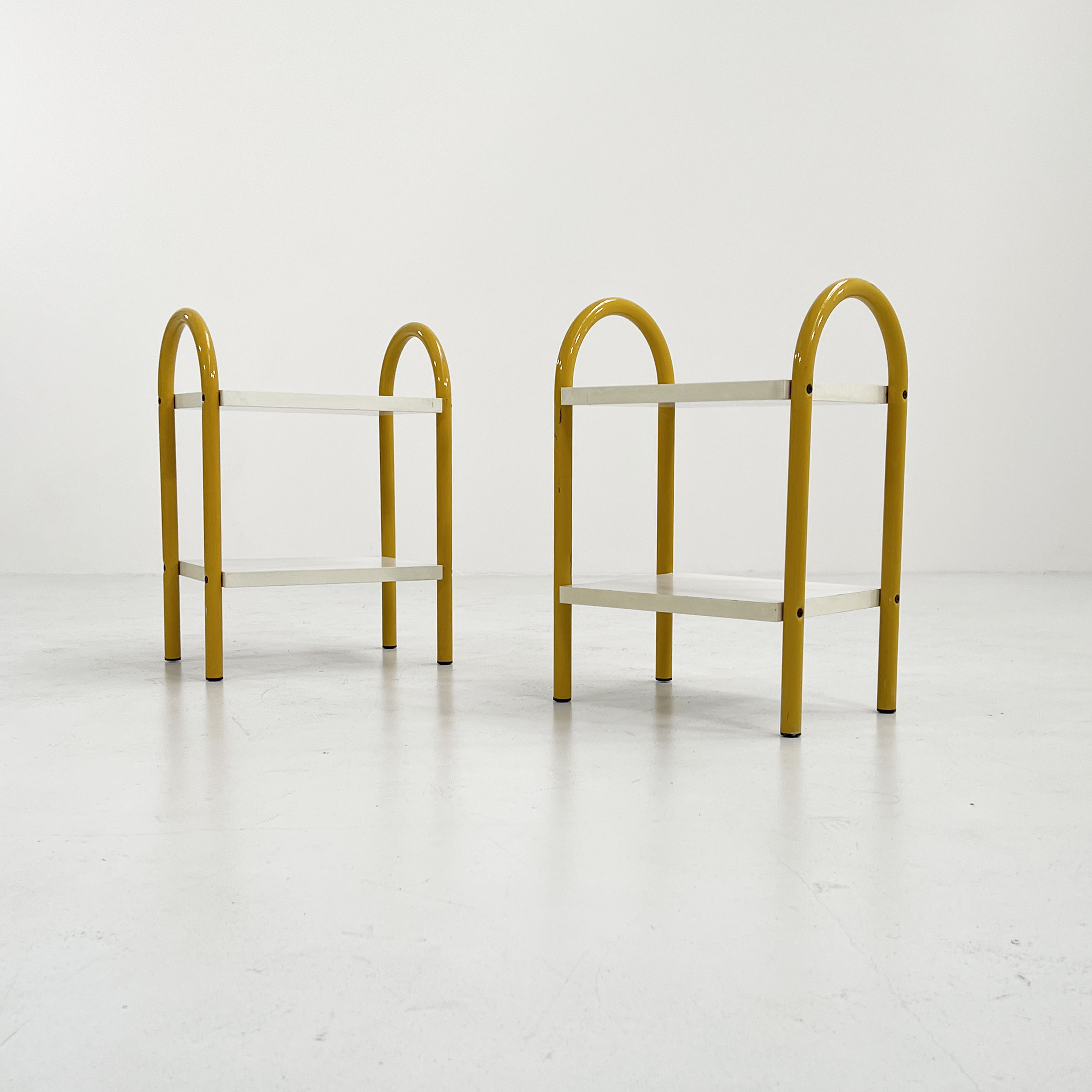 Pair of yellow tubular bedside tables, 1980