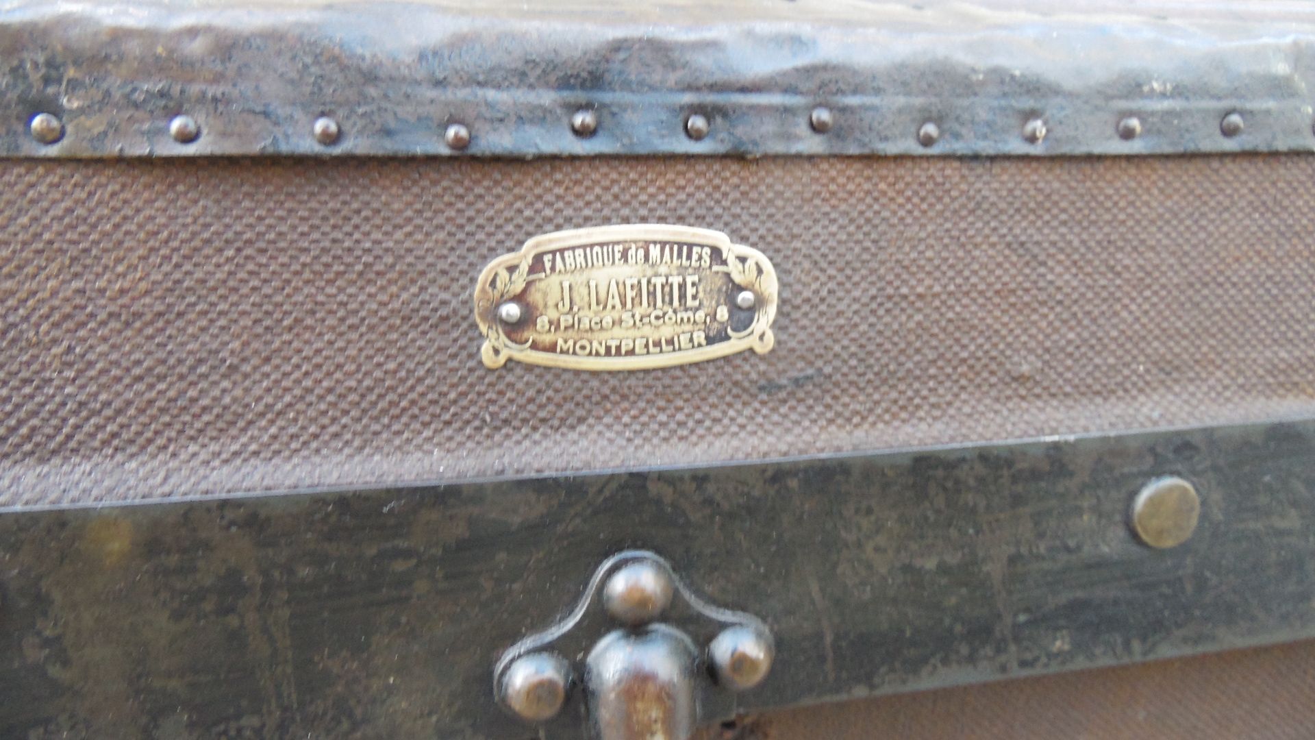 Old wooden and leather trunk, old brass nail trunk and leather strap