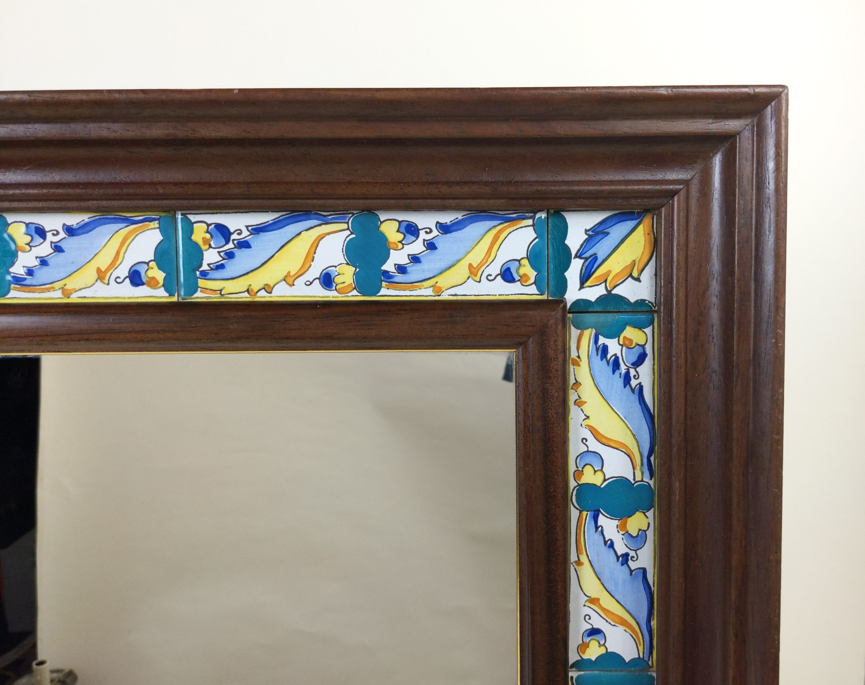 Mirror with wooden frame and painted ceramic tiles