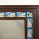 Mirror with wooden frame and painted ceramic tiles