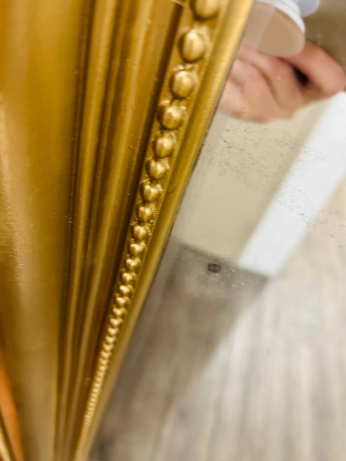 Antique gilded mirror in old Louis Philippe wood