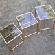 Vintage 1980s gold metal and smoked glass nesting tables