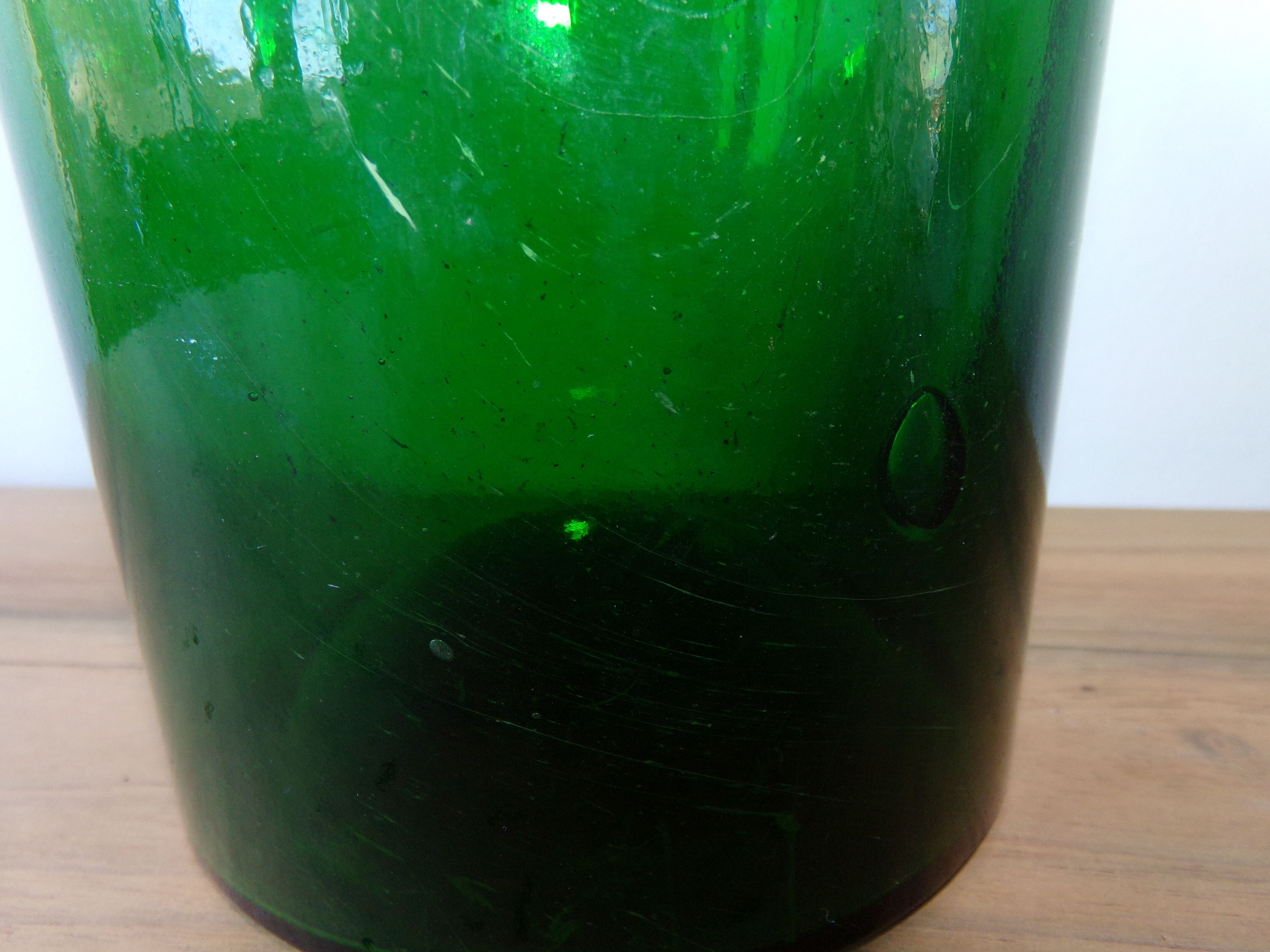 Antique green glass jar