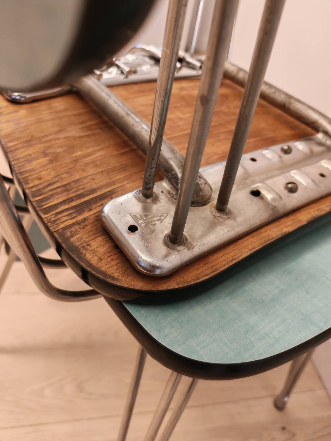 Pair of green Formica chairs with Eiffel legs