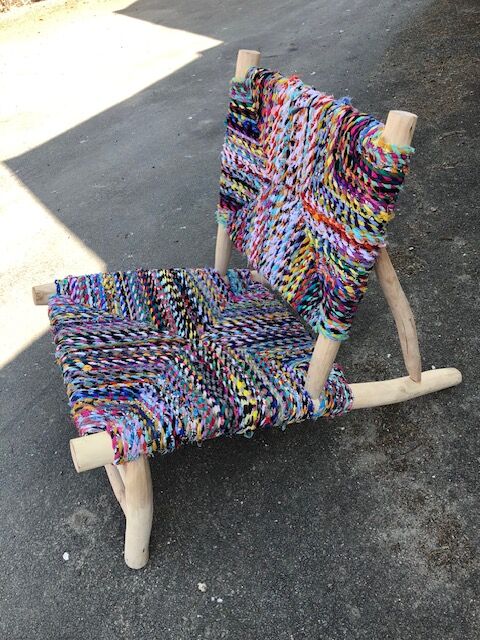 Wooden armchair braiding multicolored fabrics