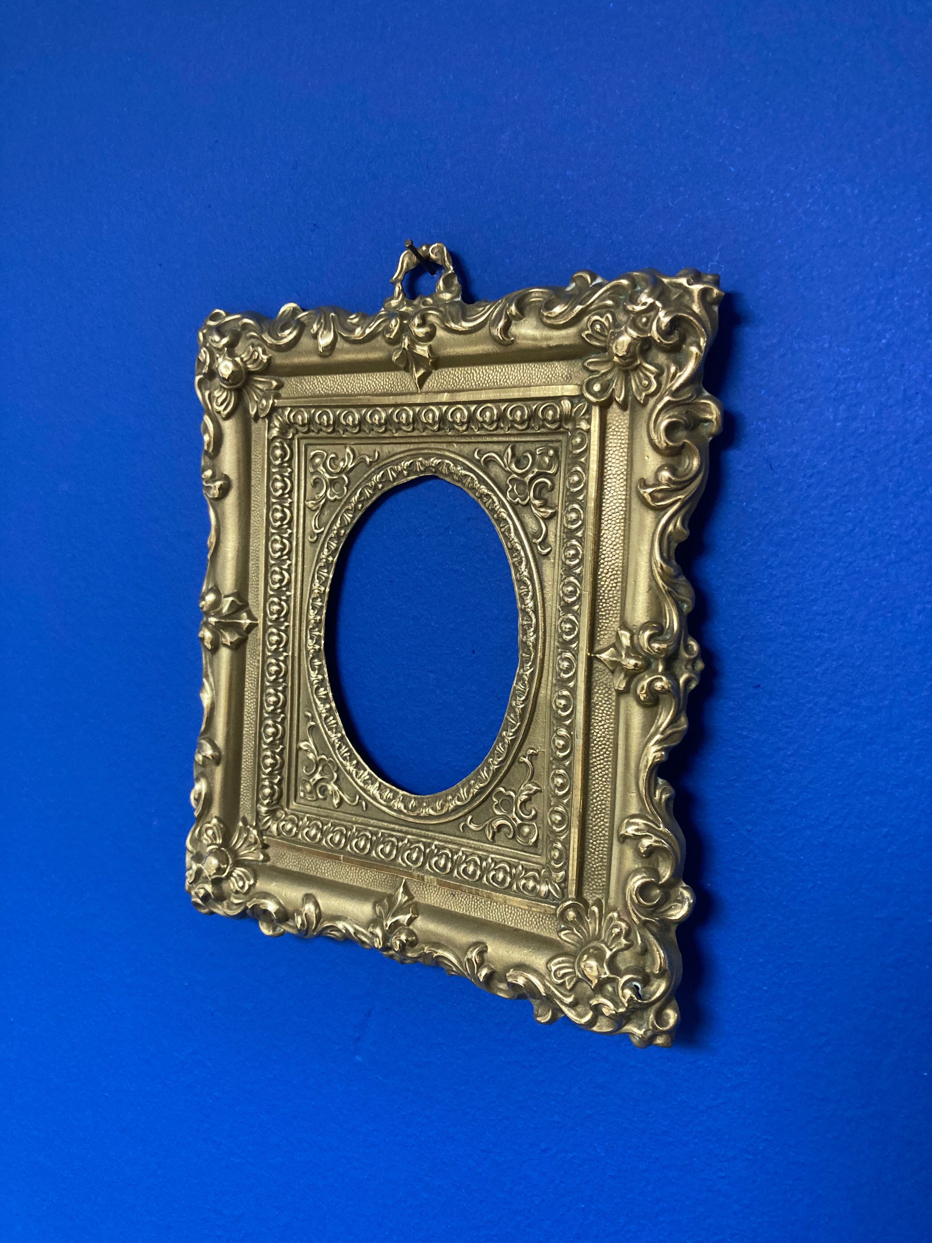 Pair of brass photo frames