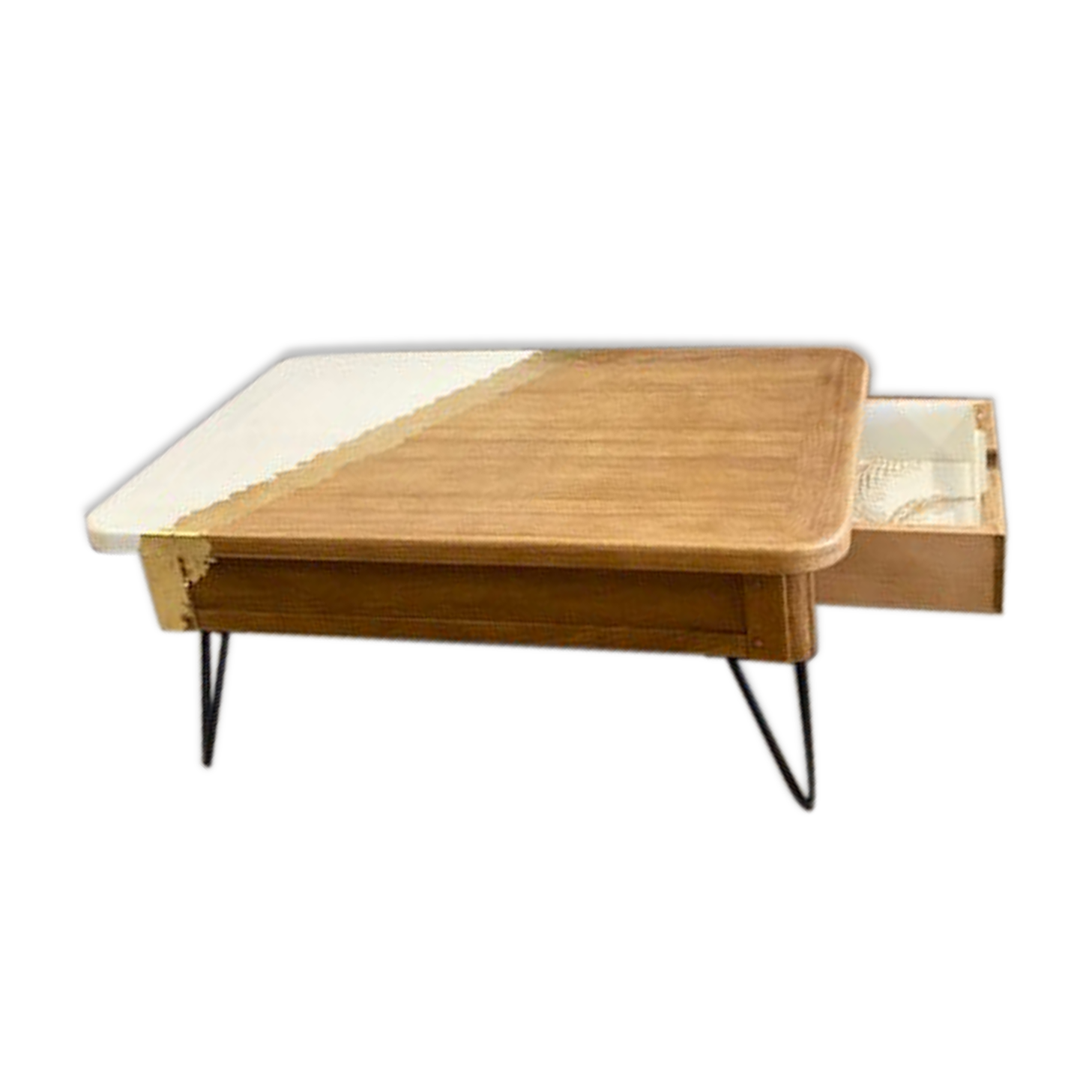 Coffee table with pin legs and gold leaf