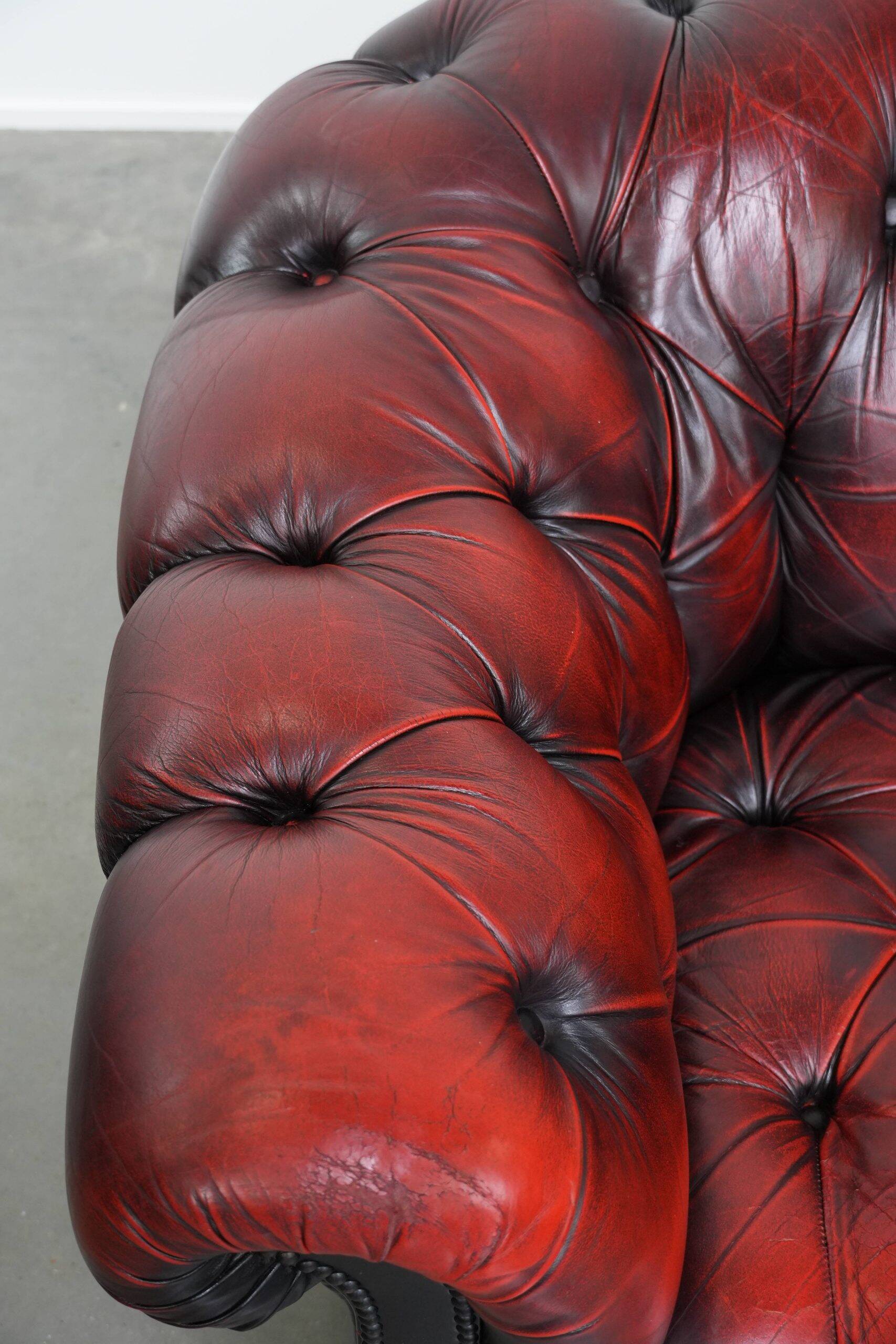 Classic cowhide Chesterfield button seat armchair in a beautiful red colour