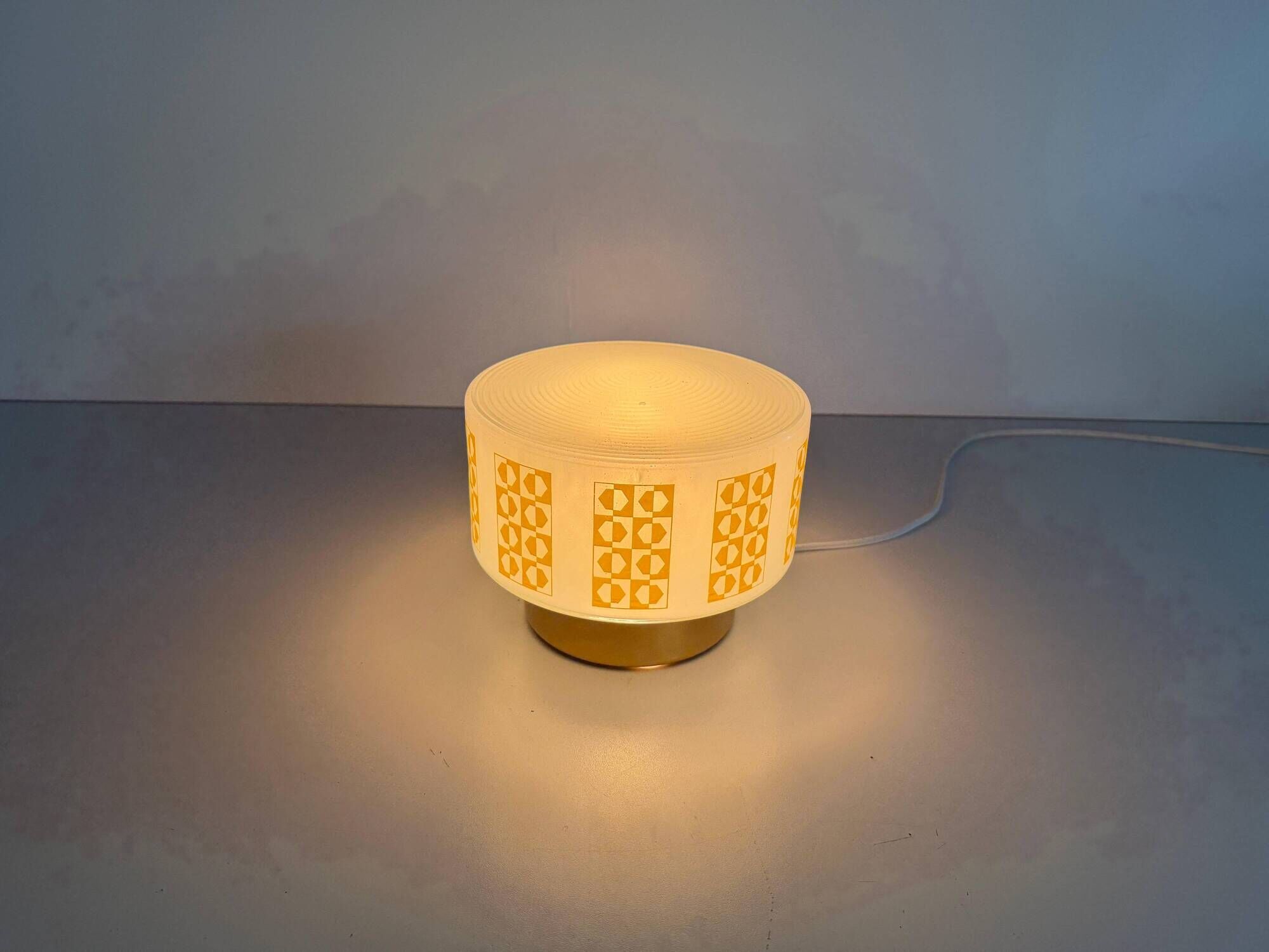 Ceiling light or wall sconce in opal glass with yellow decorations by VEB, 1950s, Germany.